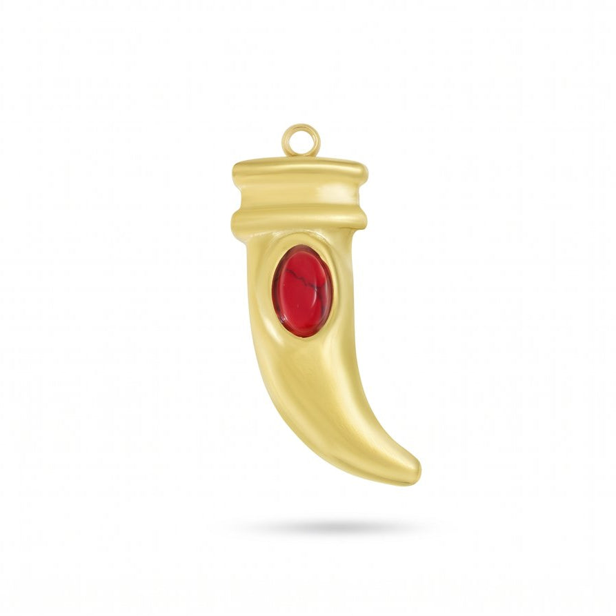 A gold crescent-shaped pendant charm featuring a central oval red gemstone, shown against a plain white background with a soft drop shadow.
